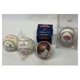 Four St. Louis Cardinals commemorative baseballs