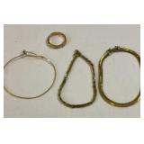 Gold colored bracelets and ring