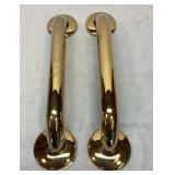 Two gold colored safety bars.  12 inch center.