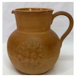 Clay looking ceramic pitcher