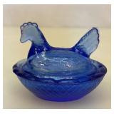 Mini cobalt blue hen on nest