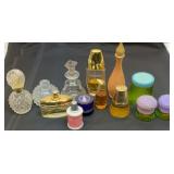 Perfume bottles.  Some with perfume.