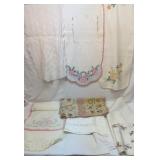 Three small tablecloths and seven runners