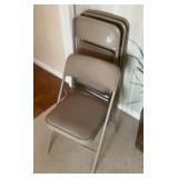 Four padded folding chairs