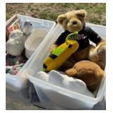 Two totes with stuffed animals, books and blankets