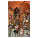 Contents of pegboard and adjacent shelves