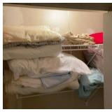 Dry goods and pillows in closet