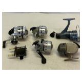 Six fishing reels. Various makers.