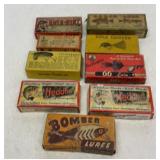 Old empty fishing lure boxes and tops