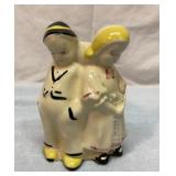 Vtg shiny Dutch boy and girl planter vase