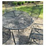 Metal patio set.  Oblong table & 4 rocker chairs