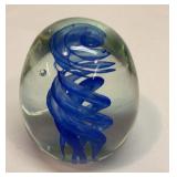 Art glass paperweight with cobalt blue swirl