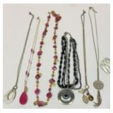 Six necklaces and a brooch