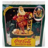 Coca-Cola Santa Claus mechanical bank.  Two of 3