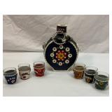 Leather wrapped decanter and six shot glasses