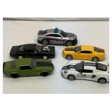 Four 1/32 scale diecast cars, etc