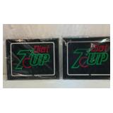 Two Diet 7-Up plastic light covers