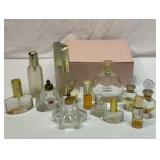 Group of perfume bottles with pink lined case