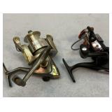 Two spincast fishing reels