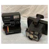 Two Polaroid cameras