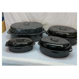 Set of four roasting pans with lids