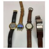 Four Fossil watches