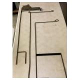 Three metal yard flag stakes