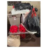Table with Christmas, comforters,  totes included