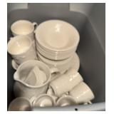Large group of dishes in tote