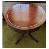 Round mahogany table with drawer and claw feet