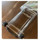 Luggage carrier with wheels