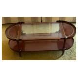 Wood and glass coffee table on wheels