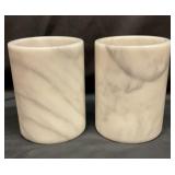 Two gray and white marble counter canisters
