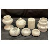 Gray and white marble covered jars, votives and