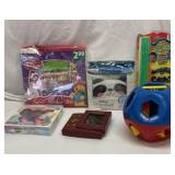 Group of kids toys and items. Tupperware ball