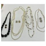Four necklace and earring sets