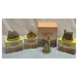 Four David Winter cottages with boxes
