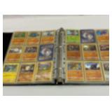 Pokï¿½mon binder full of cards. 200 plus