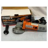 4 inch angle grinder. Works.