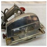 Circular saw with metal case.  Works.