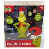 Lighted blowup Grinch yard decor. 4 feet tall.