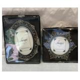 Two metal bejeweled photo frames