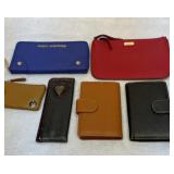 Group of wallets, glass case, etc.