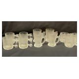 Three types of Flintstone glass mugs