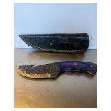 Custom fixed-blade hunting knife featuring a text.