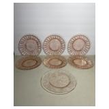 Set of seven vintage pink Depression glass plates.