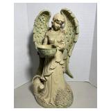 Cast resin garden angel statue with subtle green .