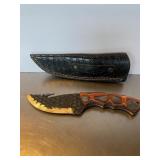 Custom fixed-blade hunting knife with a gut hook,.