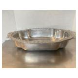 Cast aluminum or pewter oval serving bowl featuri.