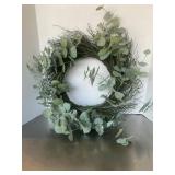 Rustic decorative wreath featuring a twig base in.